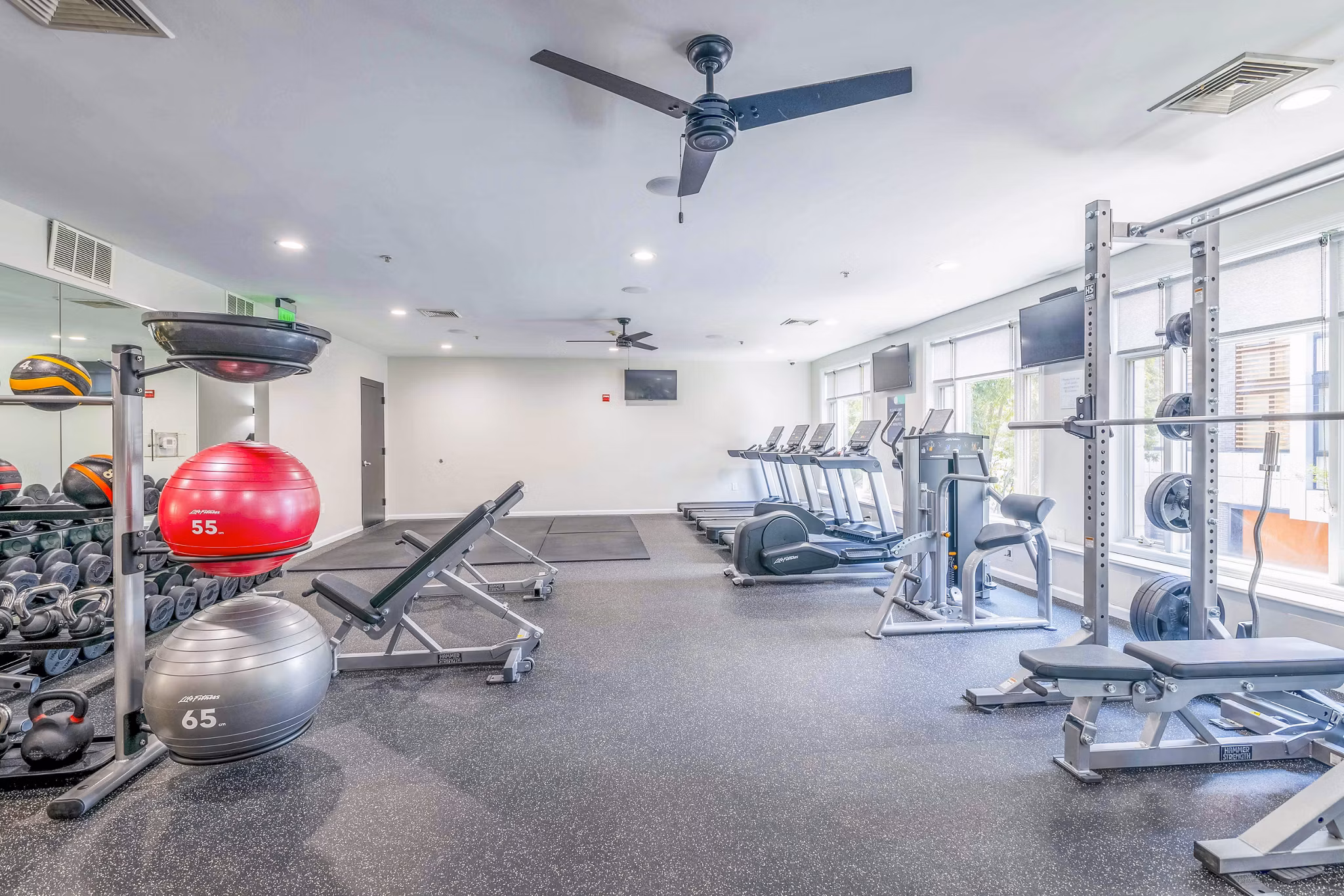 Fitness center with cardio and strength equipment at 1000 Jefferson Street Apartments