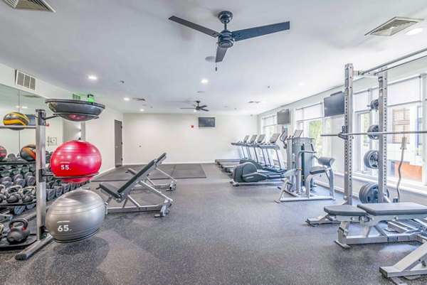 Fitness center with cardio and strength equipment at 1000 Jefferson Street Apartments