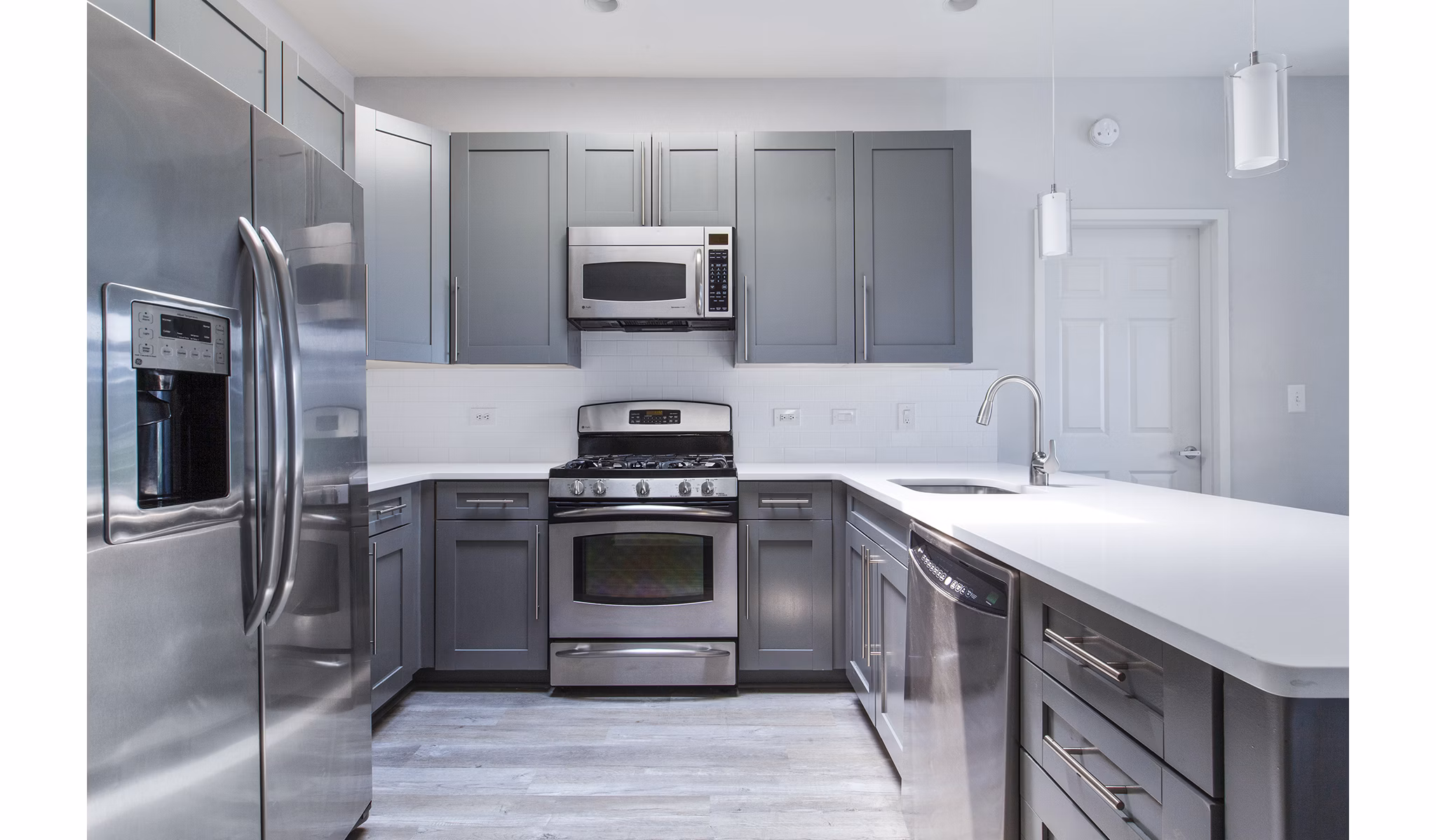 Modern kitchen featuring stainless steel appliances at 1000 Jefferson Street Apartments