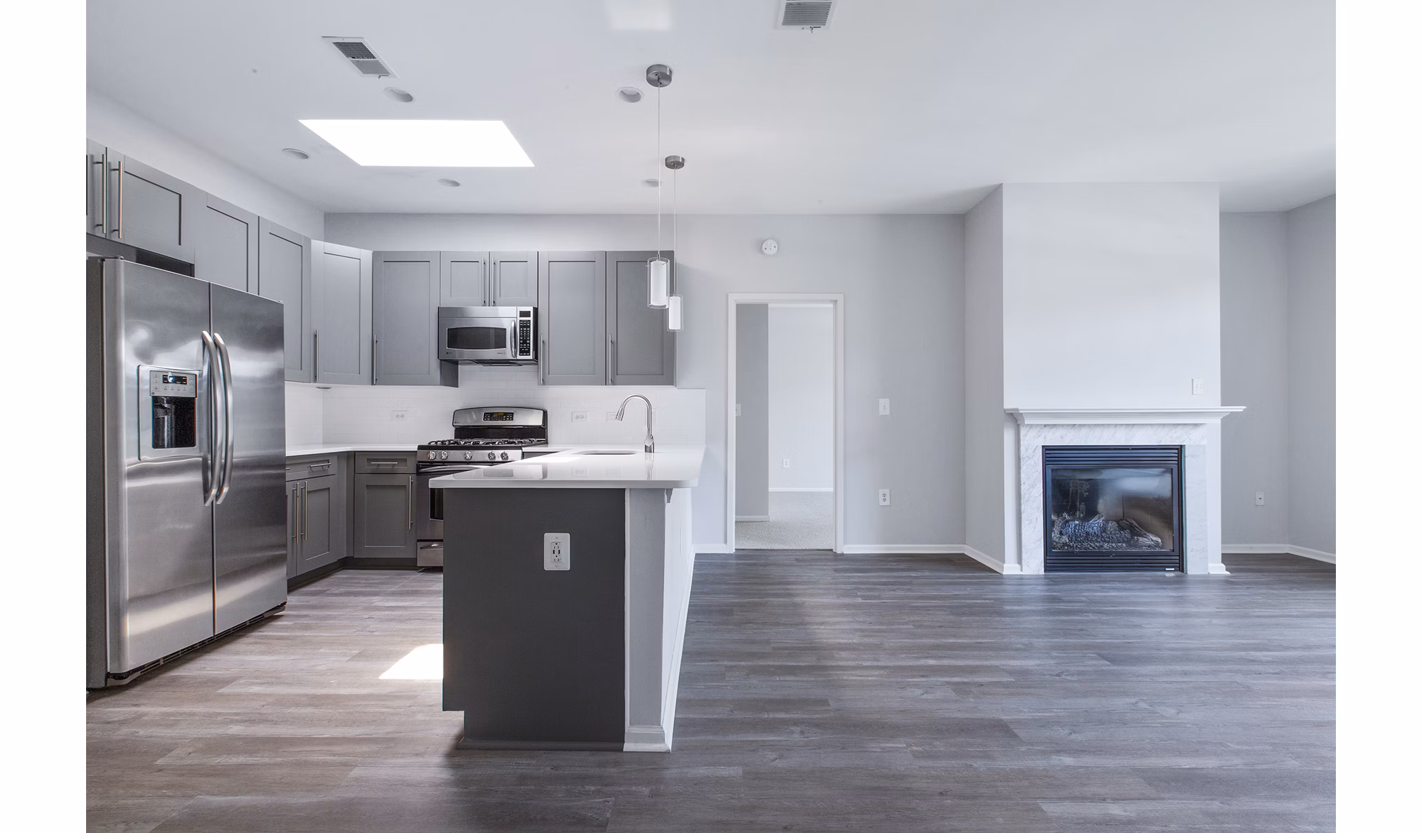 Modern kitchen with stainless steel appliances at 1000 Jefferson Street Apartments offering luxury living in a prime location