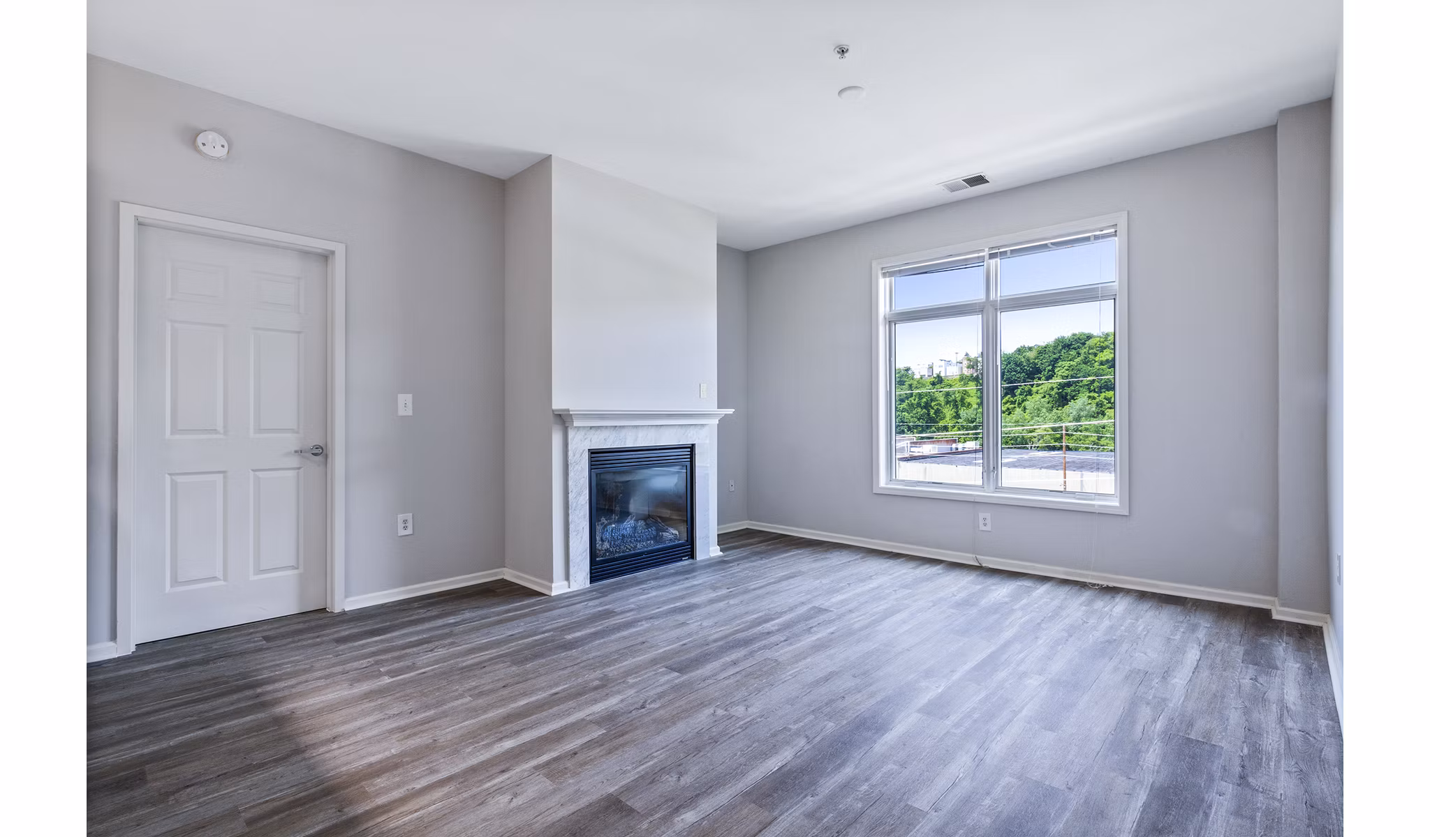 Elegant living room with modern furniture at 1000 Jefferson Street Apartments