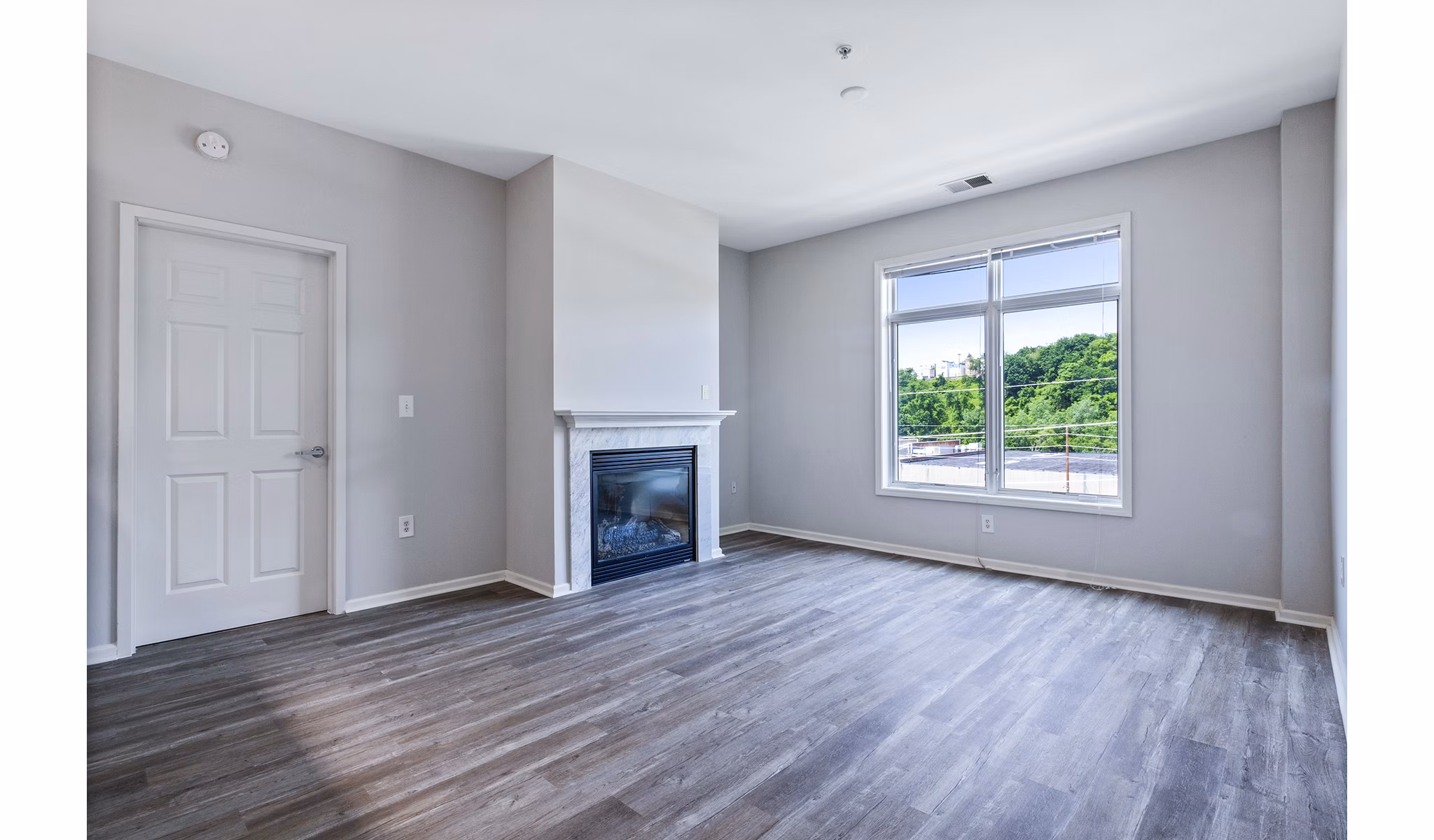 Elegant living room with modern furniture at 1000 Jefferson Street Apartments