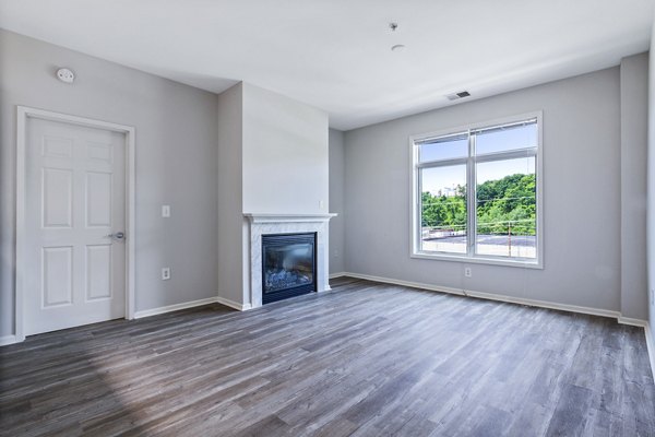 Elegant living room with modern furniture at 1000 Jefferson Street Apartments