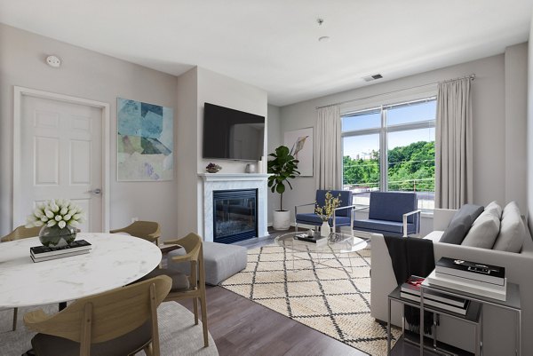 Living room featuring modern furnishings and natural light at 1000 Jefferson Street Apartments