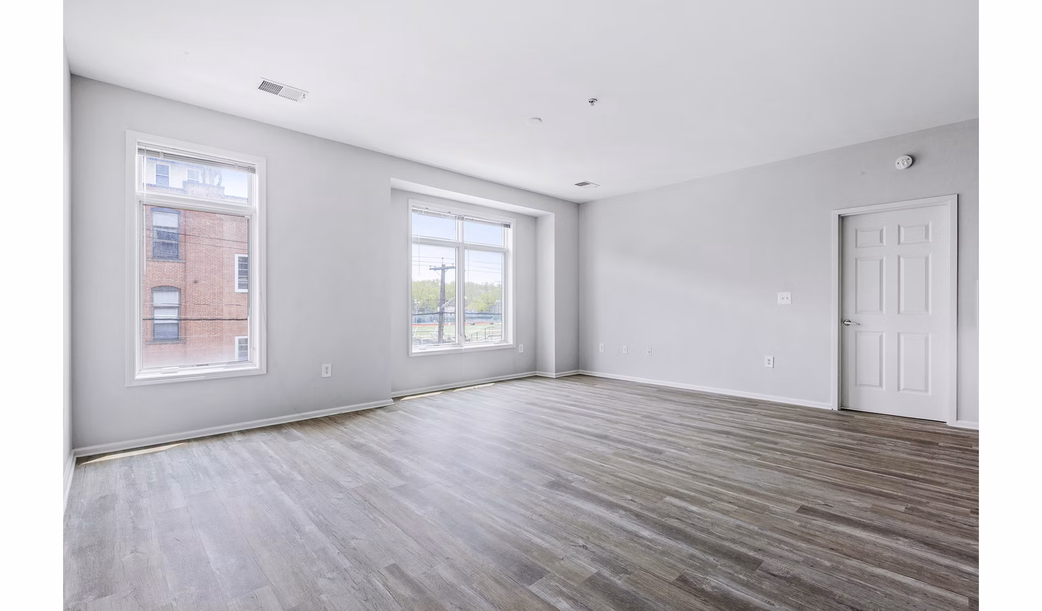 Cozy living room with modern furnishings at 1000 Jefferson Street Apartments, offering luxury lifestyle in the heart of the community