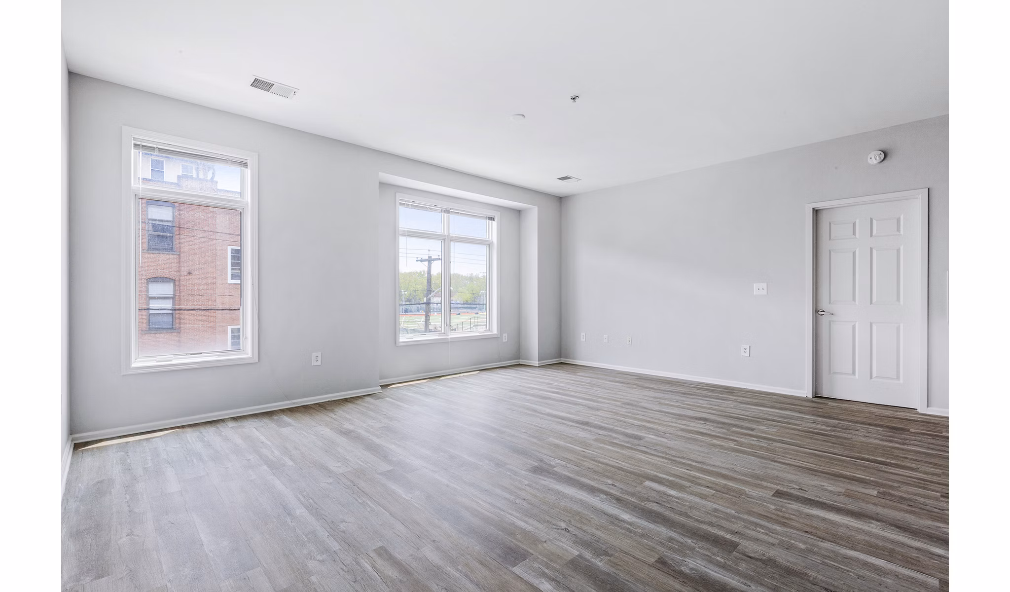 Cozy living room with modern furnishings at 1000 Jefferson Street Apartments, offering luxury lifestyle in the heart of the community