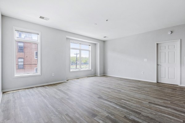 Cozy living room with modern furnishings at 1000 Jefferson Street Apartments, offering luxury lifestyle in the heart of the community