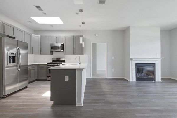 Stylish living room with modern dÃ©cor in 1000 Jefferson Street Apartments, luxury Greystar property