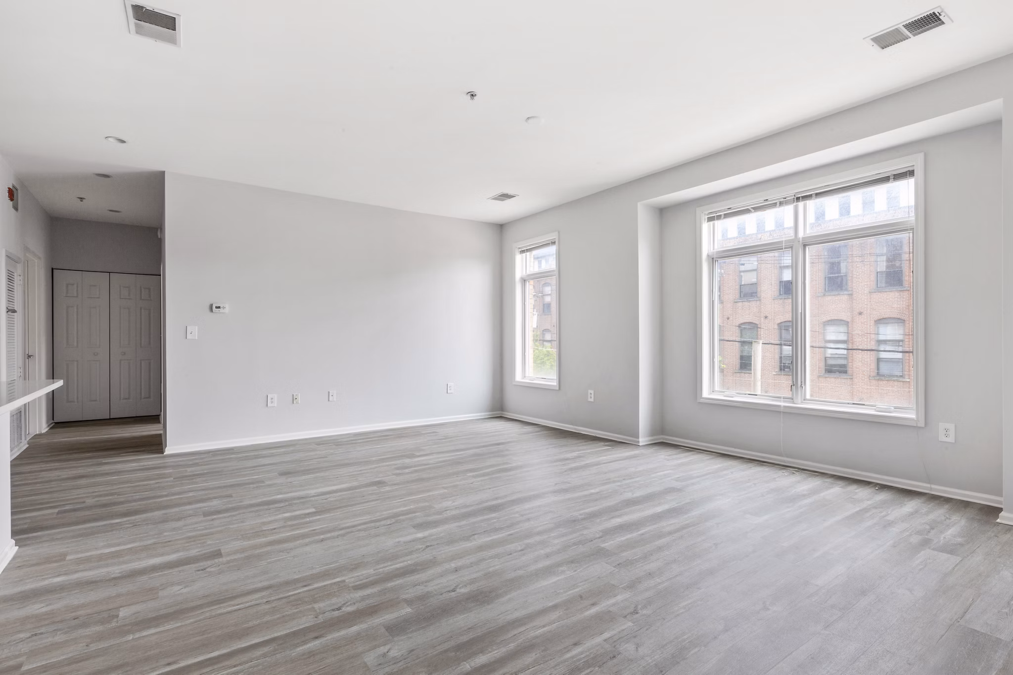 Spacious living room with modern decor at 1000 Jefferson Street Apartments