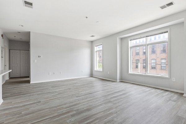 Spacious living room with modern decor at 1000 Jefferson Street Apartments