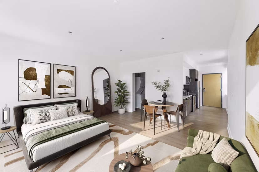 Cozy bedroom with ample natural light at Louis at 14th Apartments Modern design complements luxury apartment living