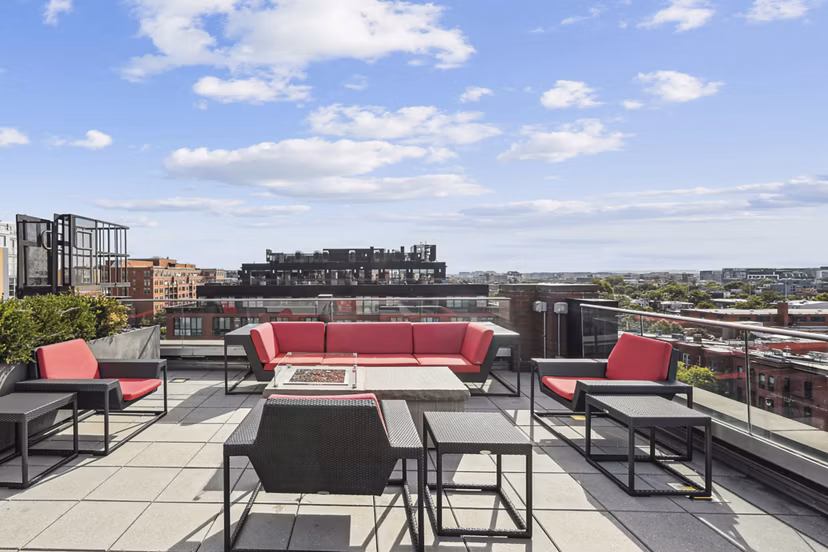 Business center with modern workstations at The Louis Apartments