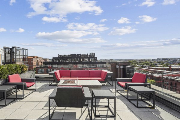 Business center with modern workstations at The Louis Apartments