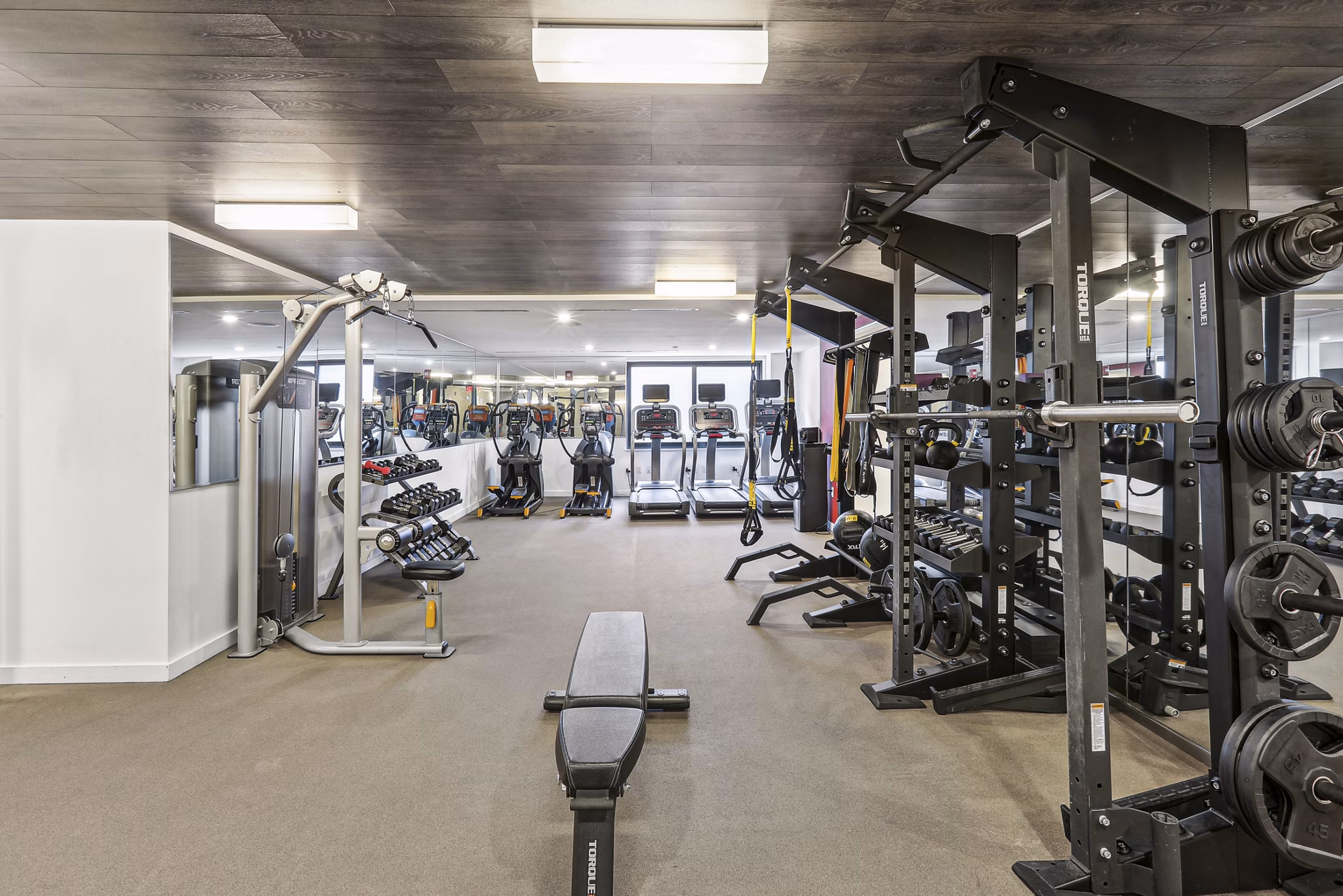 State-of-the-art fitness center with modern equipment at The Louis Apartments