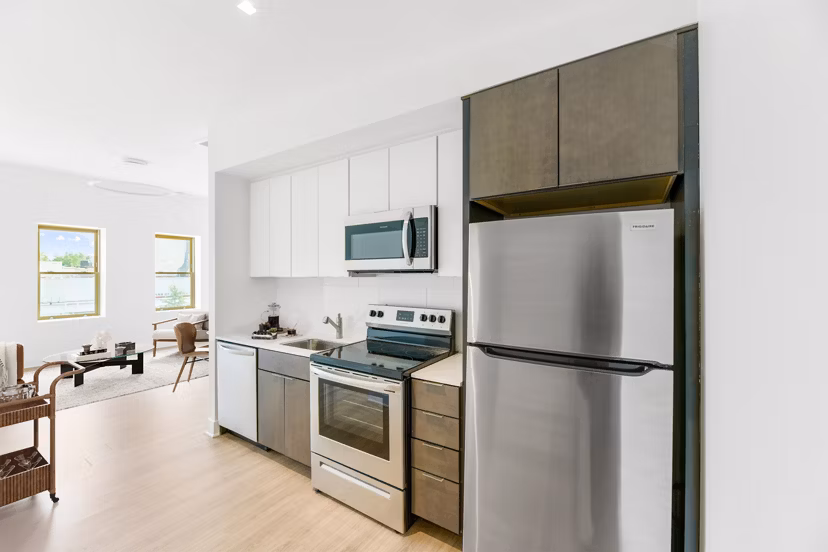 Modern kitchen with stainless steel appliances at Louis at 14th Apartments