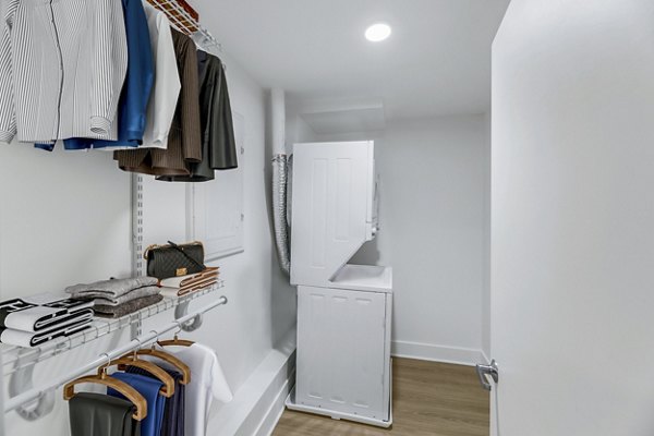 bedroom closet and laundry room at Louis at 14th Apartments
