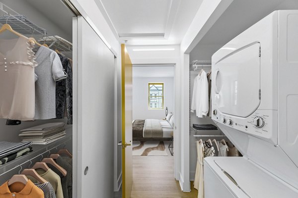 bedroom closet and laundry room at Louis at 14th Apartments