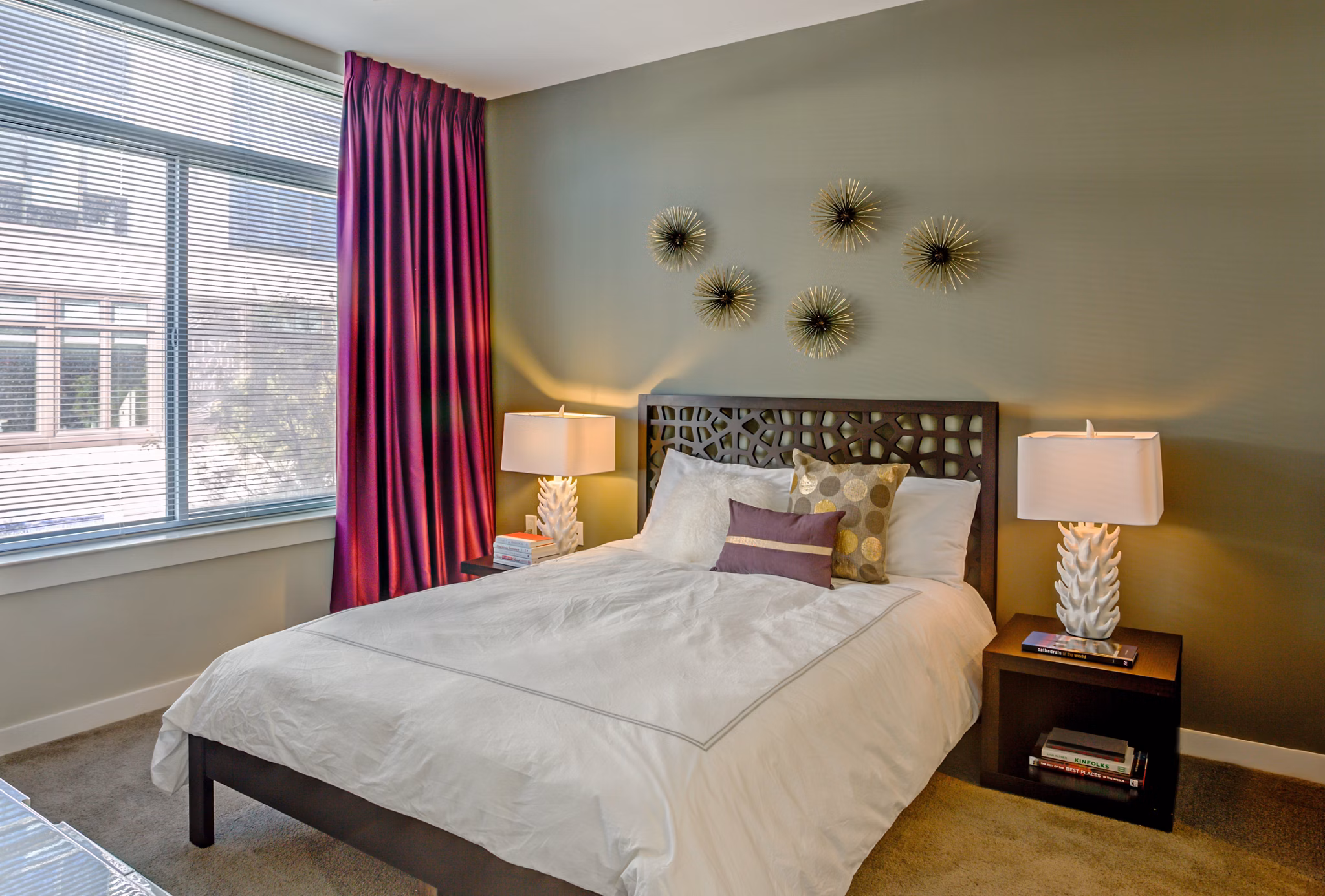 Bedroom featuring modern decor and large windows in PerSei at Pike & Rose Apartments