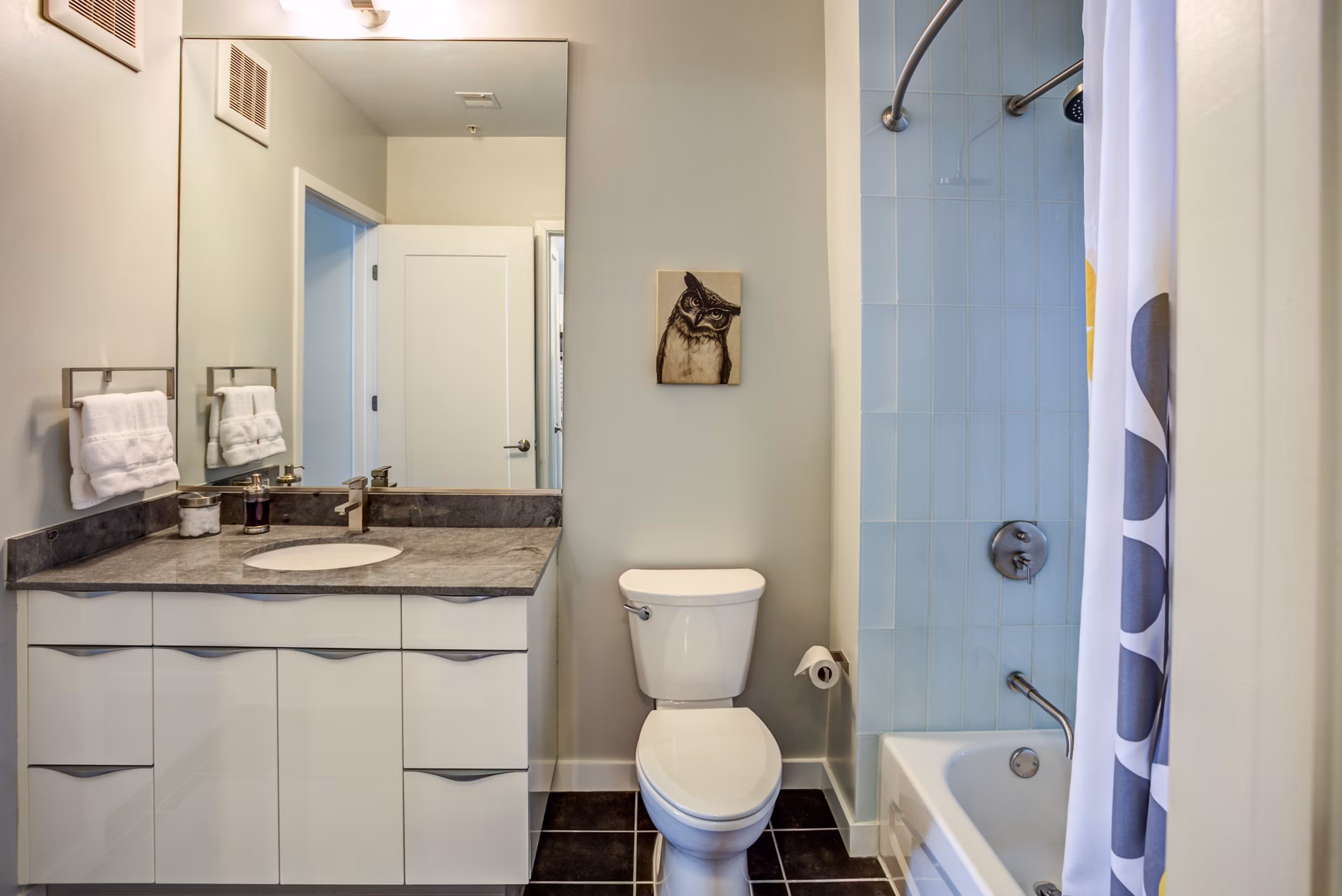 Bathroom featuring modern fixtures at PerSei at Pike & Rose Apartments