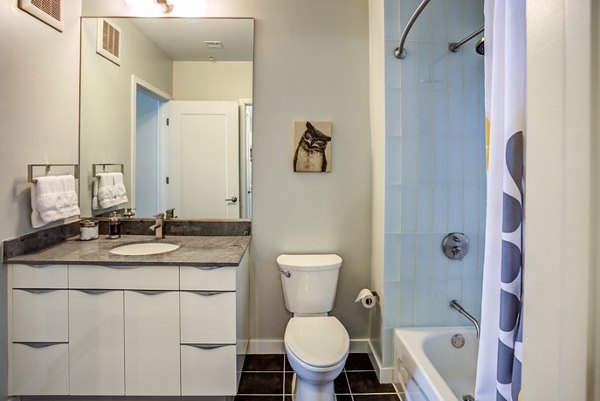 Bathroom featuring modern fixtures at PerSei at Pike & Rose Apartments
