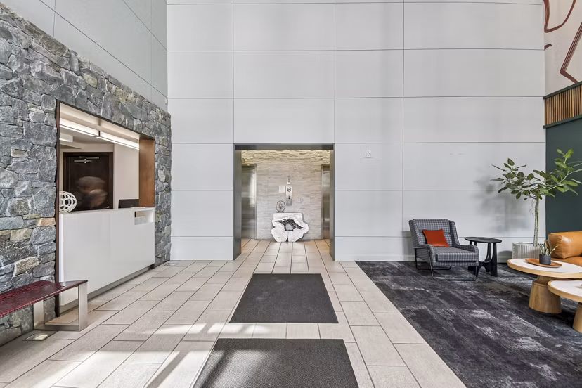 Clubhouse lounge featuring modern decor and seating at PerSei at Pike & Rose Apartments