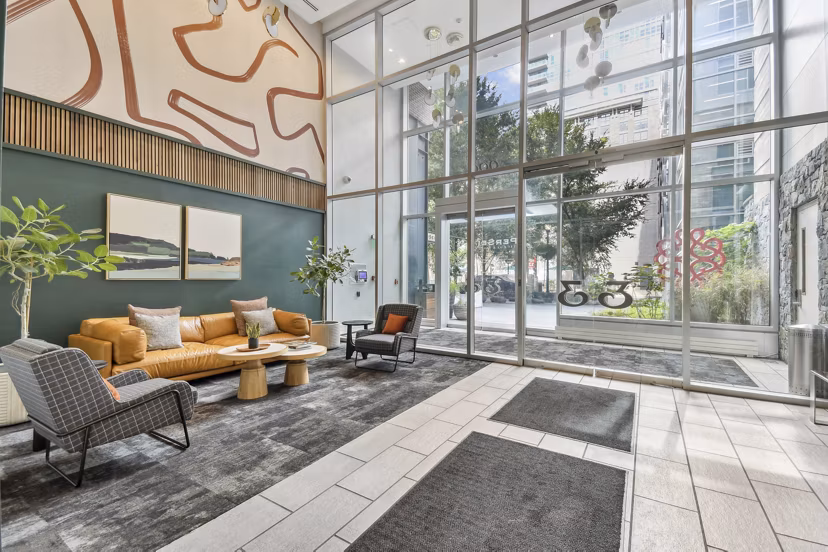 Elegant clubhouse lobby with modern seating at PerSei at Pike & Rose Apartments