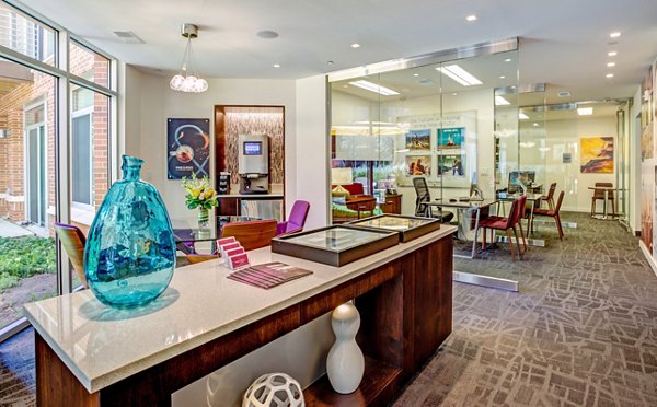 Elegant clubhouse lobby with modern seating at PerSei at Pike & Rose Apartments