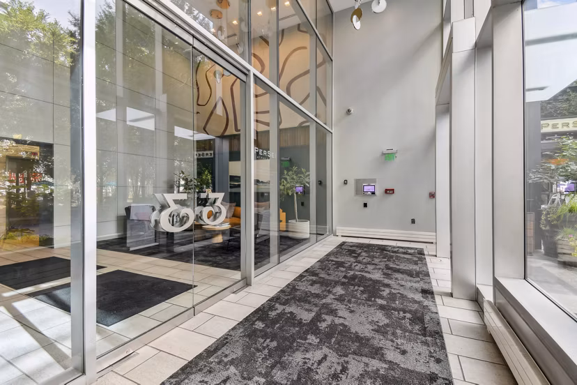 Modern clubhouse and leasing office at PerSei at Pike & Rose Apartments with stylish decor and ample seating areas