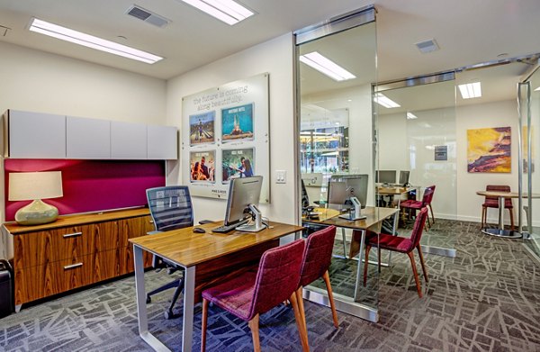 Modern clubhouse and leasing office at PerSei at Pike & Rose Apartments with stylish decor and ample seating areas