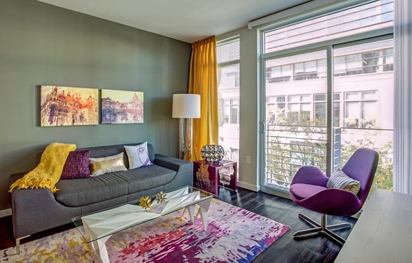 Spacious living room with modern decor at PerSei at Pike & Rose Apartments