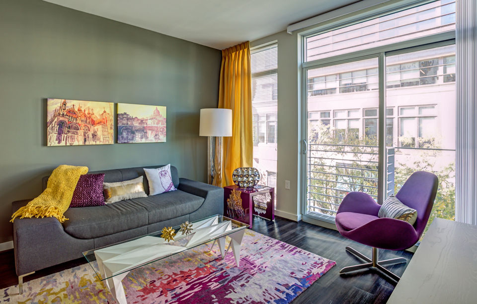 Spacious living room with modern decor at PerSei at Pike & Rose Apartments