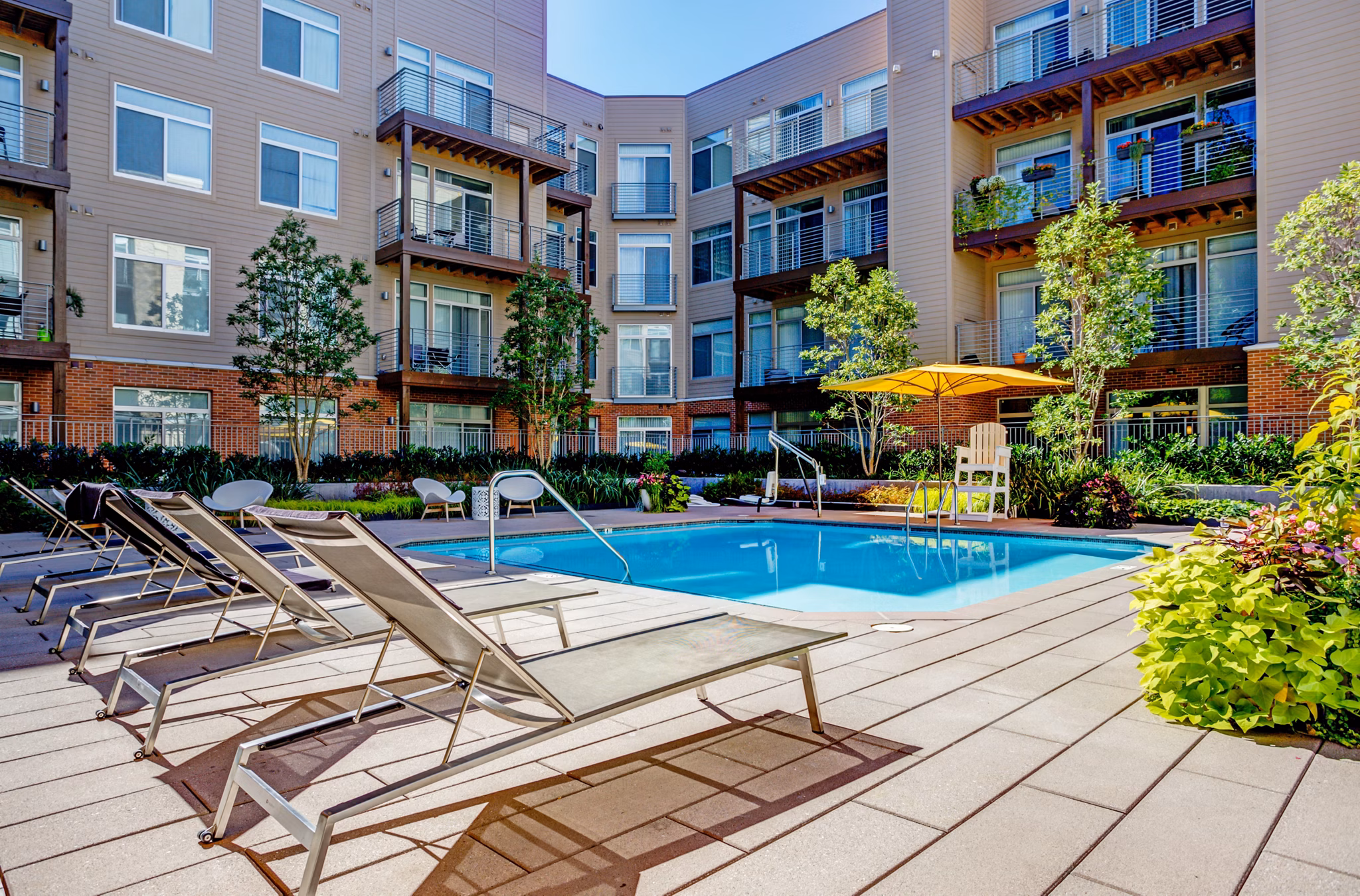 Resort-style outdoor pool at PerSei at Pike & Rose Apartments, offering luxury relaxation and modern amenities