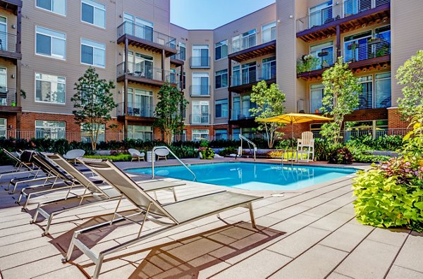 Resort-style outdoor pool at PerSei at Pike & Rose Apartments, offering luxury relaxation and modern amenities