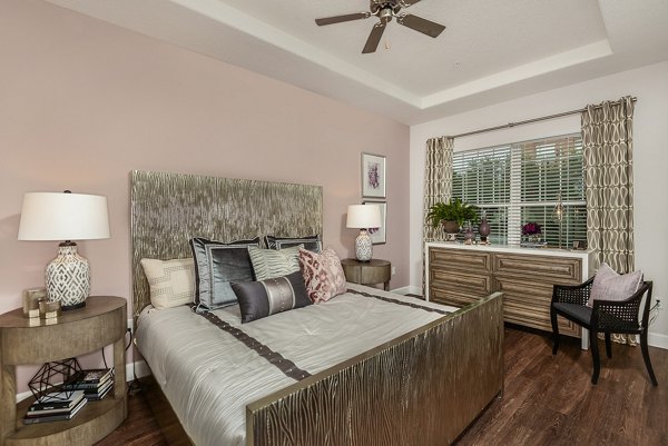 Contemporary bedroom with stylish decor at Urbana Apartments, showcasing luxury living in a tranquil setting