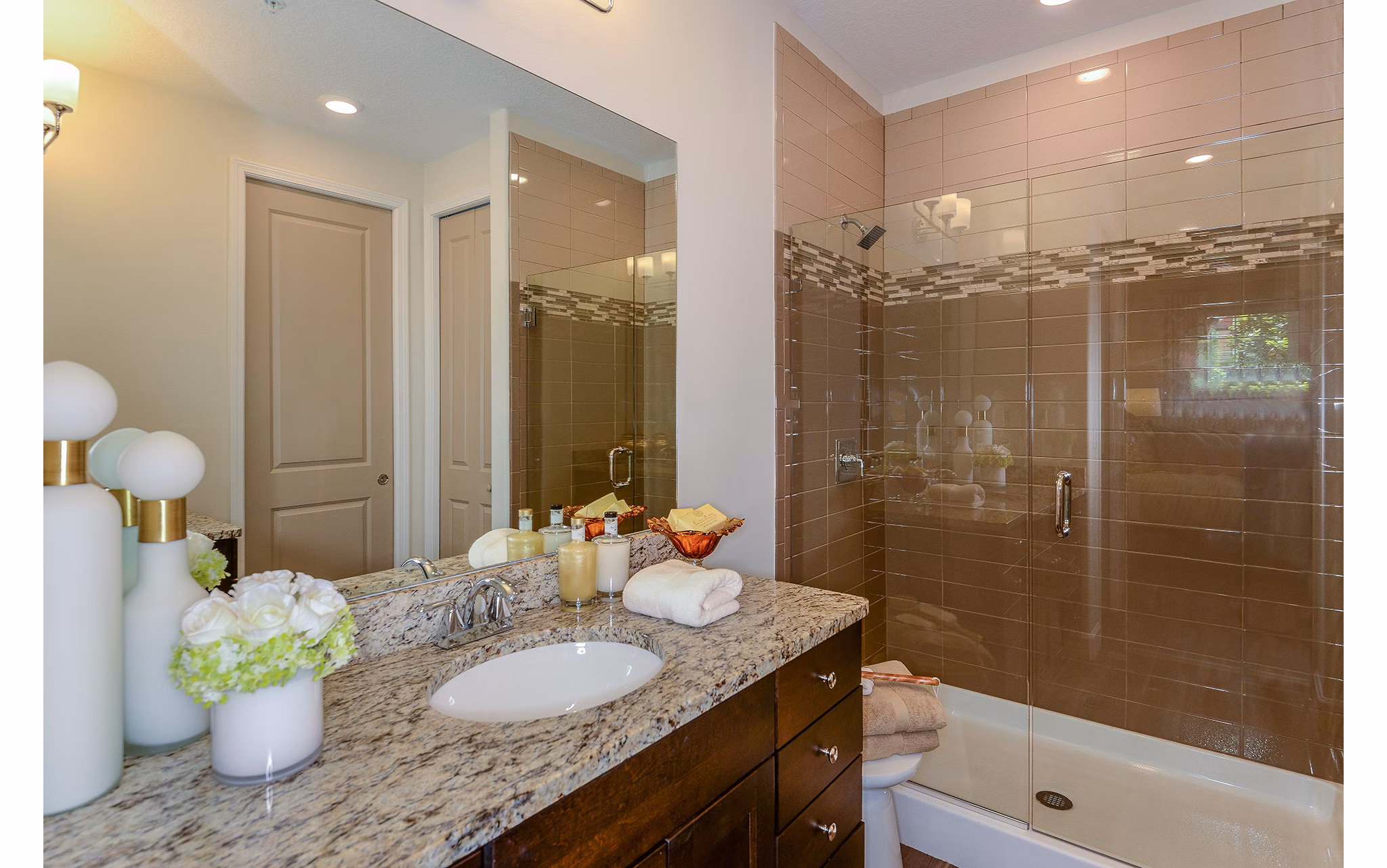 Bathroom with modern fixtures and large mirror at Urbana Apartments, Greystar luxury apartments in Lincoln Park