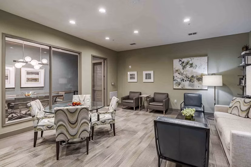 Game room featuring pool table and lounge seating at Urbana Apartments, a luxury community with recreational amenities