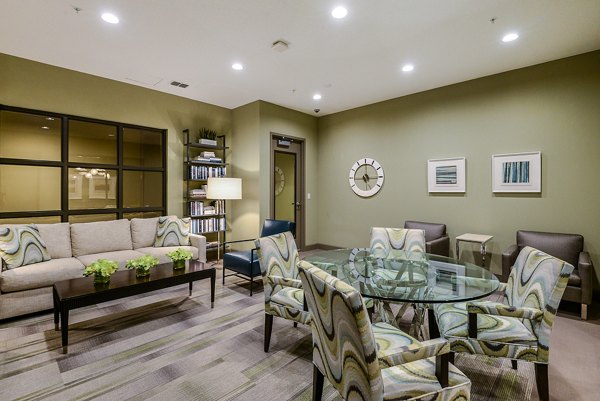 Clubhouse with modern design and seating areas at Urbana Apartments, a luxurious community offering premium amenities
