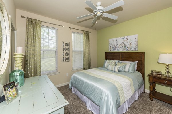 Cozy bedroom with modern design at Town Center at Lakeside Village Apartments