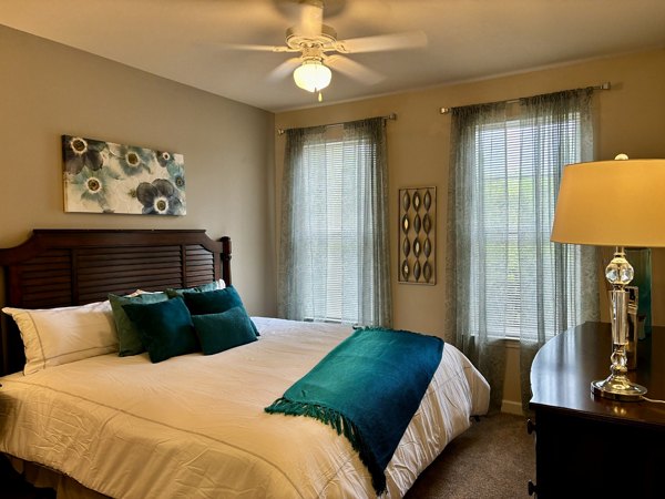 Cozy bedroom with modern decor at Town Center at Lakeside Village Apartments