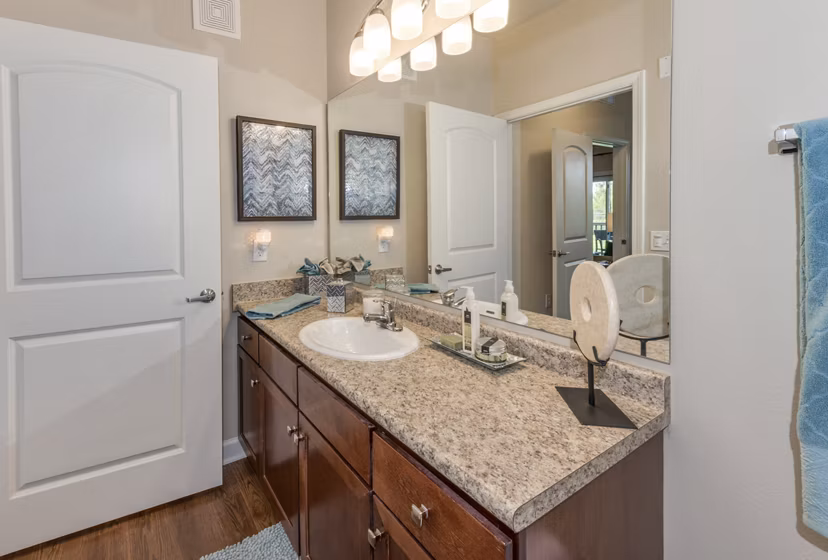 Bathroom featuring modern design and sleek fixtures at Town Center at Lakeside Village Apartments