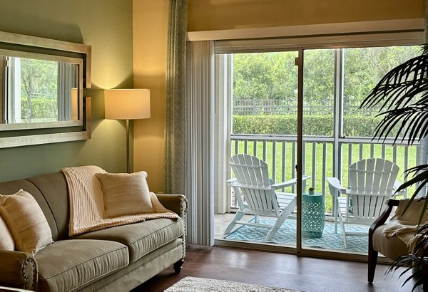 Spacious living room with modern furnishings in Town Center at Lakeside Village Apartments