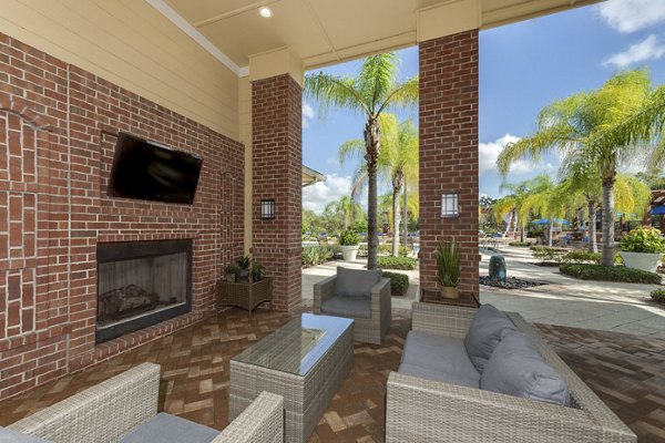 Cozy fire pit area at Town Center at Lakeside Village Apartments, perfect for social gatherings and relaxation under the stars