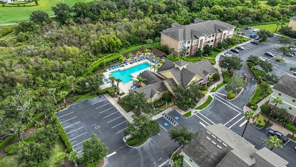 View of landscaped gardens and fountain at Town Center at Lakeside Village Apartments