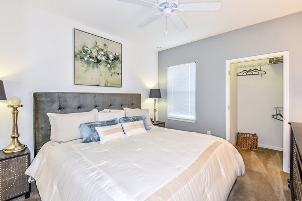 Cozy bedroom with modern decor at Windermere Cay Apartments