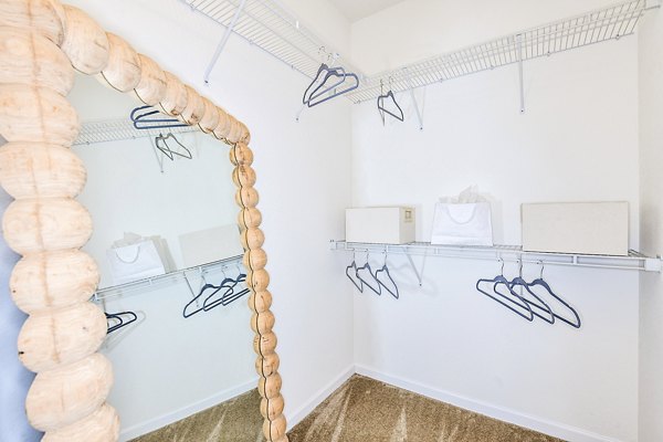 Spacious bedroom closet with ample storage at Windermere Cay Apartments in a luxury Greystar community