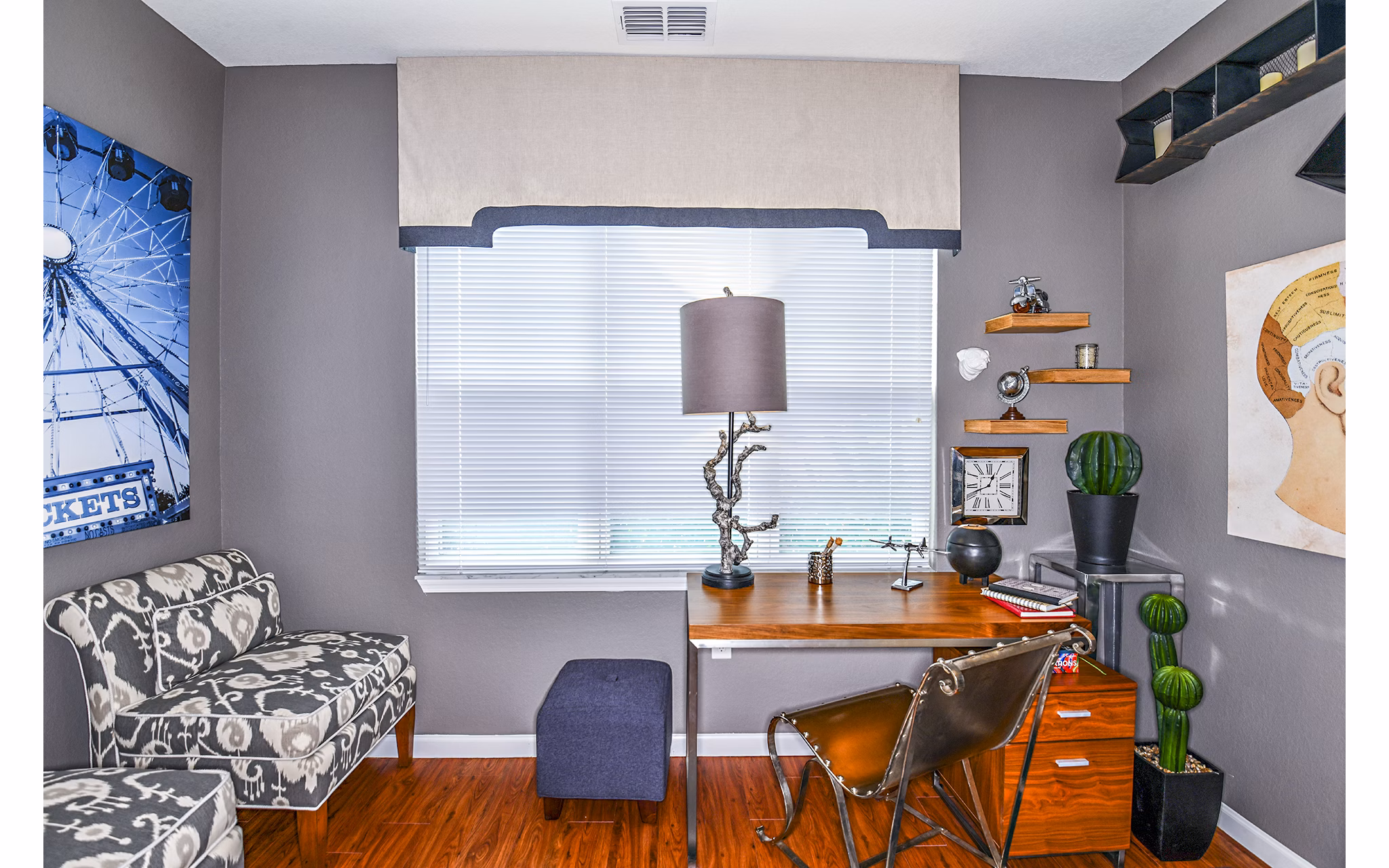 Home office with modern desk and ergonomic chair at Windermere Cay Apartments