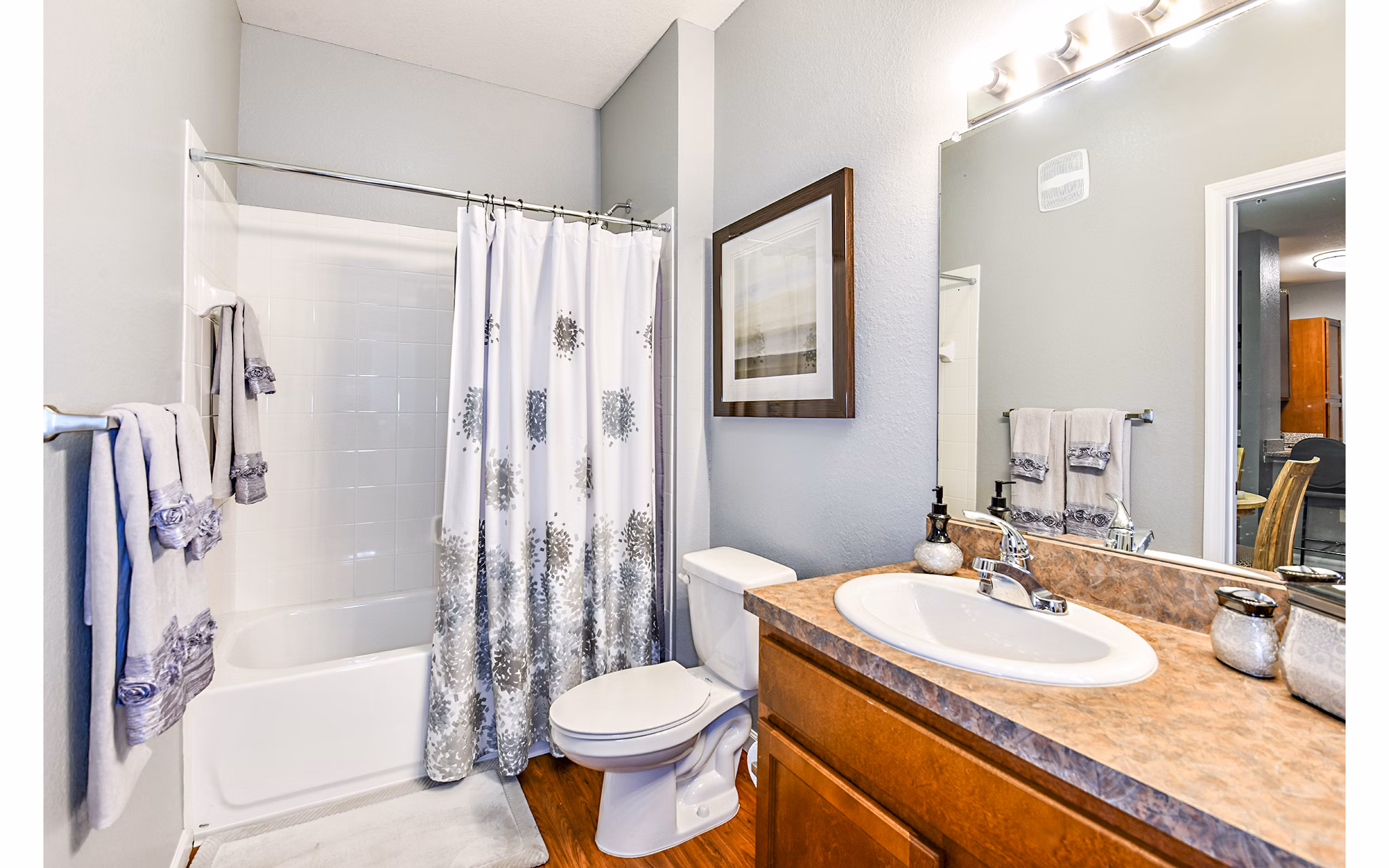 Modern bathroom with sleek fixtures and tile flooring at Windermere Cay Apartments, offering luxury living in a stylish setting