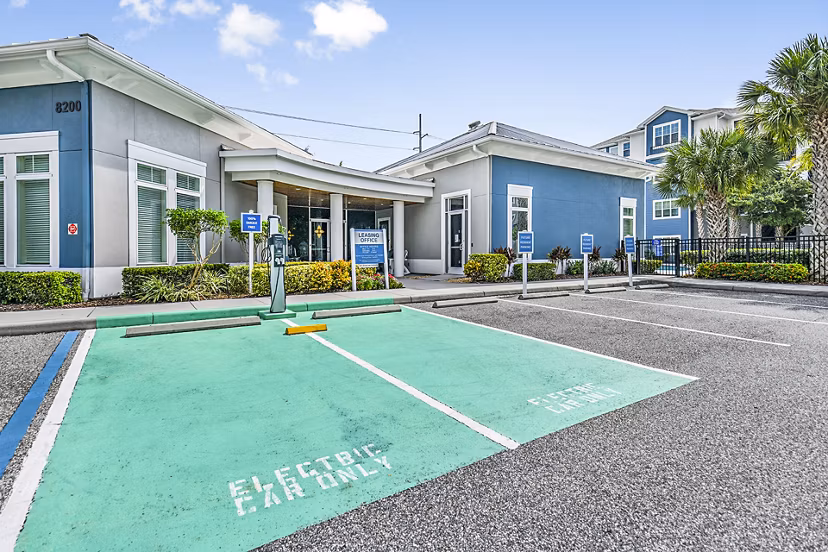Clubhouse with car charging station at Windermere Cay Apartments, offering convenience and modern amenities for residents