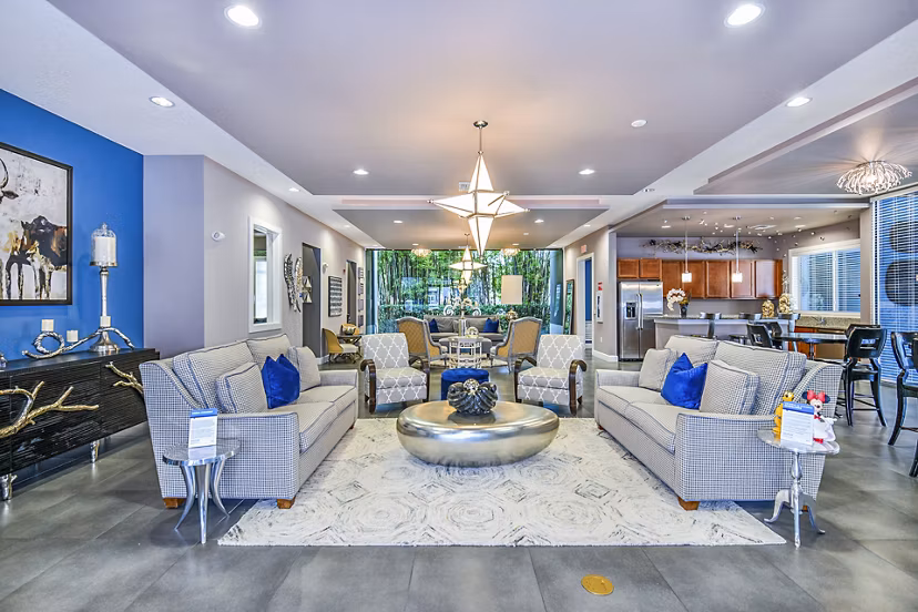 Elegant clubhouse with modern furnishings at Windermere Cay Apartments, ideal for social gatherings and community events
