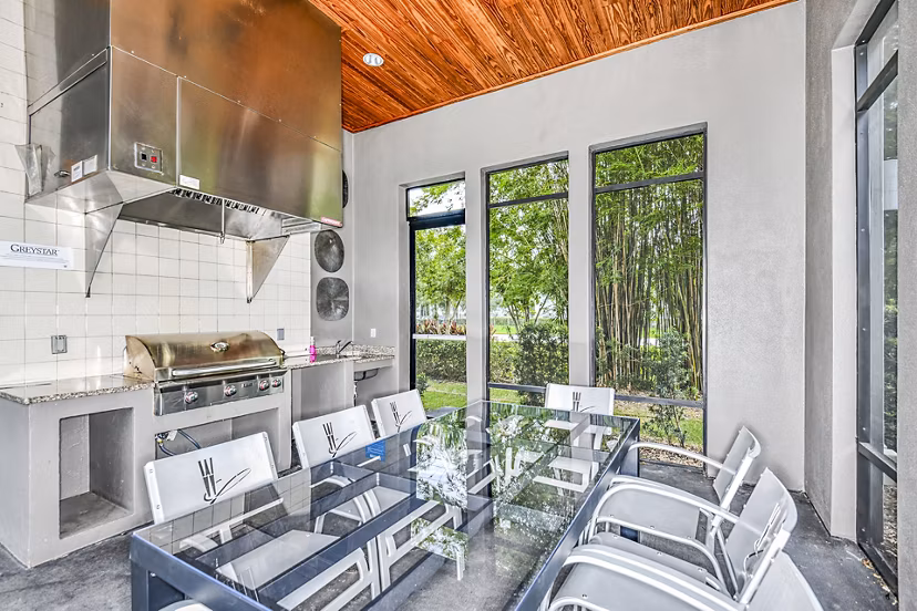 Clubhouse with elegant seating and modern decor at Windermere Cay Apartments, a Greystar luxury community